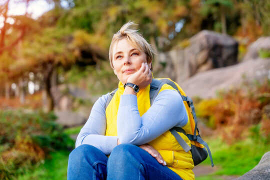 Woman  reaching the destination and taking selfie, photos,  and shouting on the top of mountain  Travel Lifestyle concept The national park Peak District in England