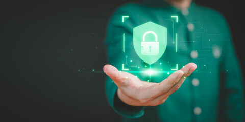 Man show on hand with cybersecurity and privacy icon for security protection system. Lock icon and internet network security technology. User protecting personal data, virtual screen interface.