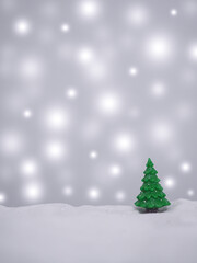 Christmas tree with shiny light for Christmas and New Year holidays background, Winter season, falling snow, Copy space for Christmas and New Year holidays greeting card.