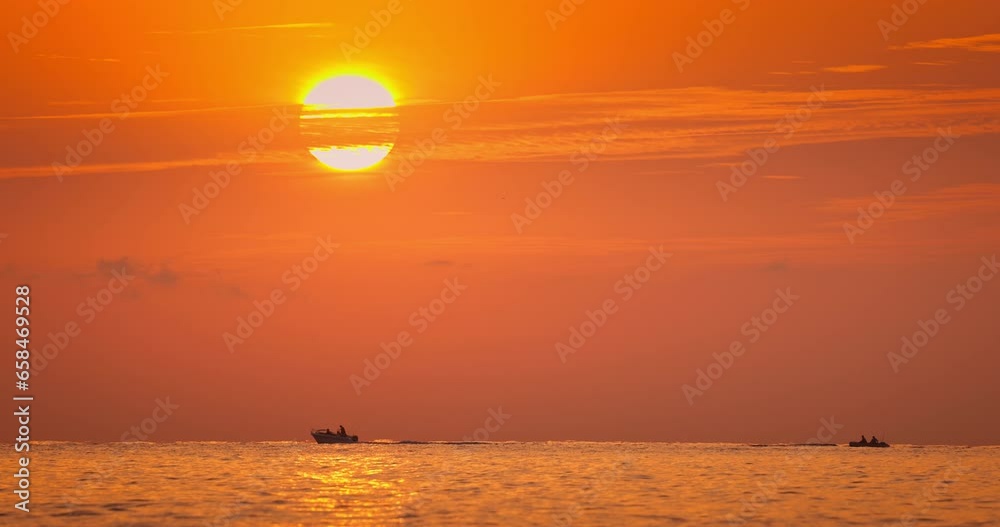 Canvas Prints Sun rising up over sea horizon and ripple waves, tropical ocean sunrise and sailing boat