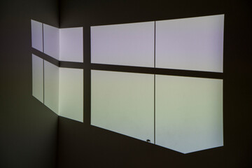 Geometric flat pane shape projected on wall by projector