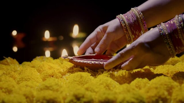 Clay diya lamps lit during diwali celebration, Diwali, or Deepavali, is India's biggest and most important holiday.