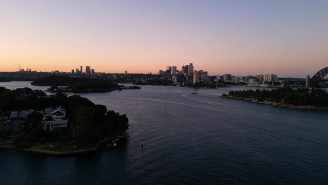 Sydney, Australia: Cinematic aerial drone footage of the luxury Balmain residential district by the Sydney harbor bay in Australia largest city at dusk on a clear winter day. 