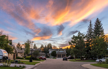 Sunset view in cul-de-sac city landscape with triangle shape clouds
