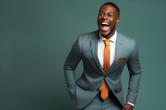 Handsome Happy African American Man Laughing And Smiling In Blue Business Suit On Blue Colour Background, Colourful Studio Portrait