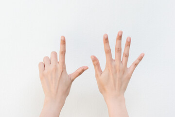 Women showing finger on white background.Counting number seven.