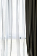 Curtain draperies at window, close up.