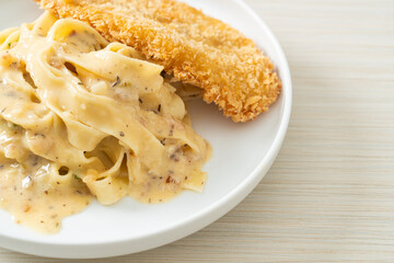 fettuccine pasta white cream sauce with fried fish