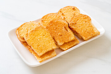 baked crispy bread with butter and sugar
