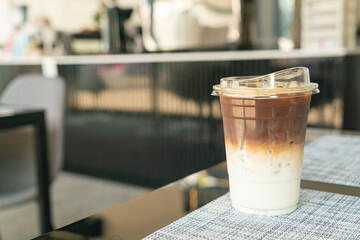 iced latte coffee cup on table