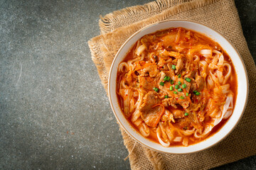 Korean udon ramen noodles with pork in kimchi soup