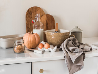 Preparation of seasonal autumn pumpkin pastries. Ingredients, dishes in retro style in a bright...