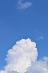 beautiful blue sky and white fluffy group of clouds with sunrise in the morning, natural background