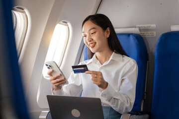 Using mobile and credit card, cashless payment, Thoughtful asian people female person onboard,...