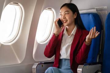 Passionate female asian chinese japanese people student aboard airplane, clutching textbooks,...