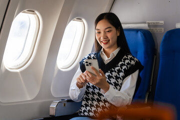 Passionate female asian chinese japanese people student aboard airplane, clutching textbooks,...