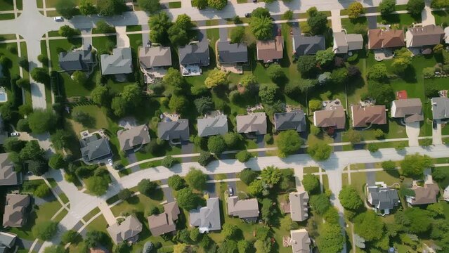 Aerial Drone above shot of american new suburb at summertime. Establishing shot of neighborhood. aerial footage