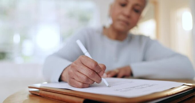Woman, writing and documents for life insurance, policy or application in legal agreement at home. Closeup of female person filling form, survey or paperwork in deal or questionnaire on desk at house