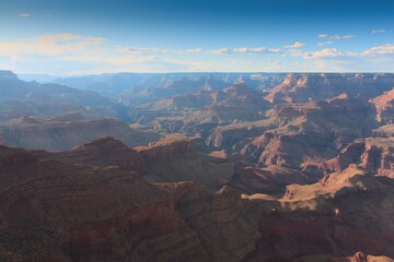 Fototapeta na wymiar The Grand Canyon, Arizona. White clouds are in a blue sky.