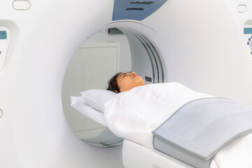 Asian woman patient check up her body by ct scan machine