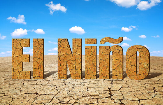 Landscape with dry cracked soil and El Niño text. Concept of change climate.	