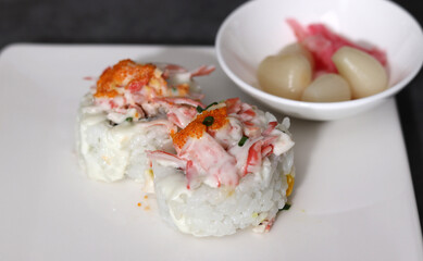 Close-up images of healthy and fresh sushi. Close-up image of roll on a plate.
