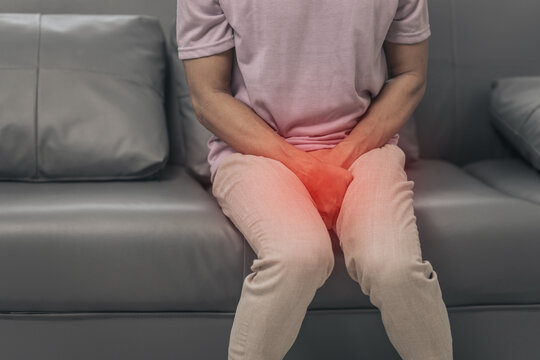 Prostate cancer and men's health, Middle-aged Asian Indian man grappling with testicular discomfort. Vivid portrayal of male health challenges, urging awareness and timely medical consultations.