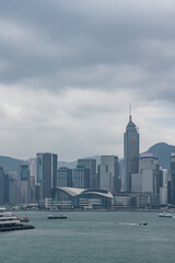 Obraz premium The tall financial center building and surrounding bustling buildings in Central, Hong Kong