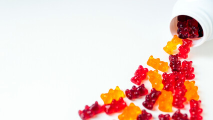 Vitamins and supplements gummy bears  on a white background. Top view, flat lay. 