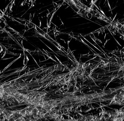 Wrinkled plastic wrap texture on a black background wallpaper. Royalty high-quality free stock photo image of realistic plastic wrap for overlay, copy space and photo effect. Wrinkled plastic surface