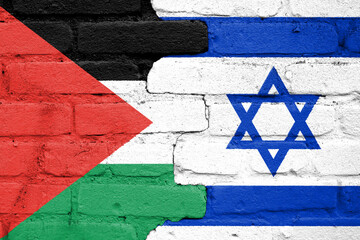 Flags of Israel and Palestine painted on the brick wall. Gaza and Israel conflict