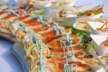 detail shot of a plate of sushi and canapés