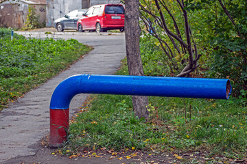 Metal installation in a park alley on an autumn day