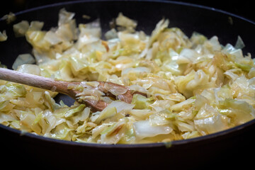 Cooking cabbage in a pan