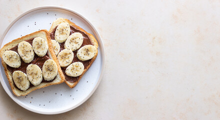 Sandwich with chocolate paste, banana and chia seeds. Breakfast. Vegetarian food.
