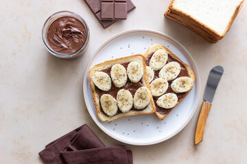Sandwich with chocolate paste, banana and chia seeds. Breakfast. Vegetarian food.
