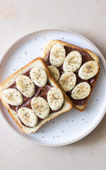 Sandwich with chocolate paste, banana and chia seeds. Breakfast. Vegetarian food.