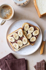 Sandwich with chocolate paste, banana and chia seeds. Breakfast. Vegetarian food.