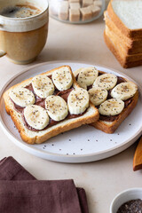 Sandwich with chocolate paste, banana and chia seeds. Breakfast. Vegetarian food.