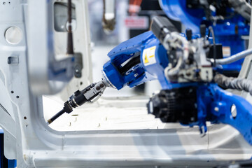 robot arm working in car factory