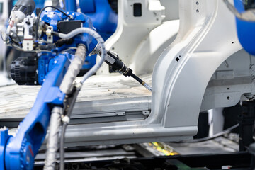 Fototapeta premium robot arm working in car factory