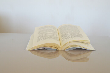 the reflection of an open book