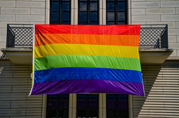 rainbow flag on the roof - obrazy, fototapety, plakaty