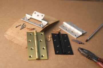 Installation of furniture hinges in chipboard. Small carpentry work in the workshop. light...