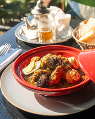 Moroccan beef tagine with prunes, boiled eggs, sesame seeds and walnuts