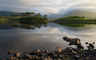 Beautiful lakeside landscape scenery of twelve pines island at Derryclare lake, Connemara national Park in County Galway, Ireland 