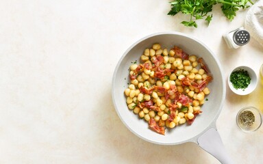 Potato gnocchi with bacon and greens