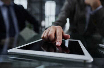 businessman pressing his finger on the screen of the digital tab