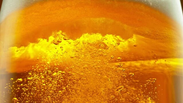 Super Slow Motion of Macro Shot of Pouring Beer Drink, Close-up. Filmed on High Speed Cinema Camera, 1000 fps.