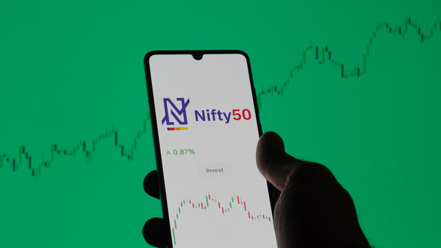 October 07th 2023, India. An investor analyzing the Nifty trend on a phone. The logo of Nifty50 on the screen of an stock exchange. Nifty index price on a device.